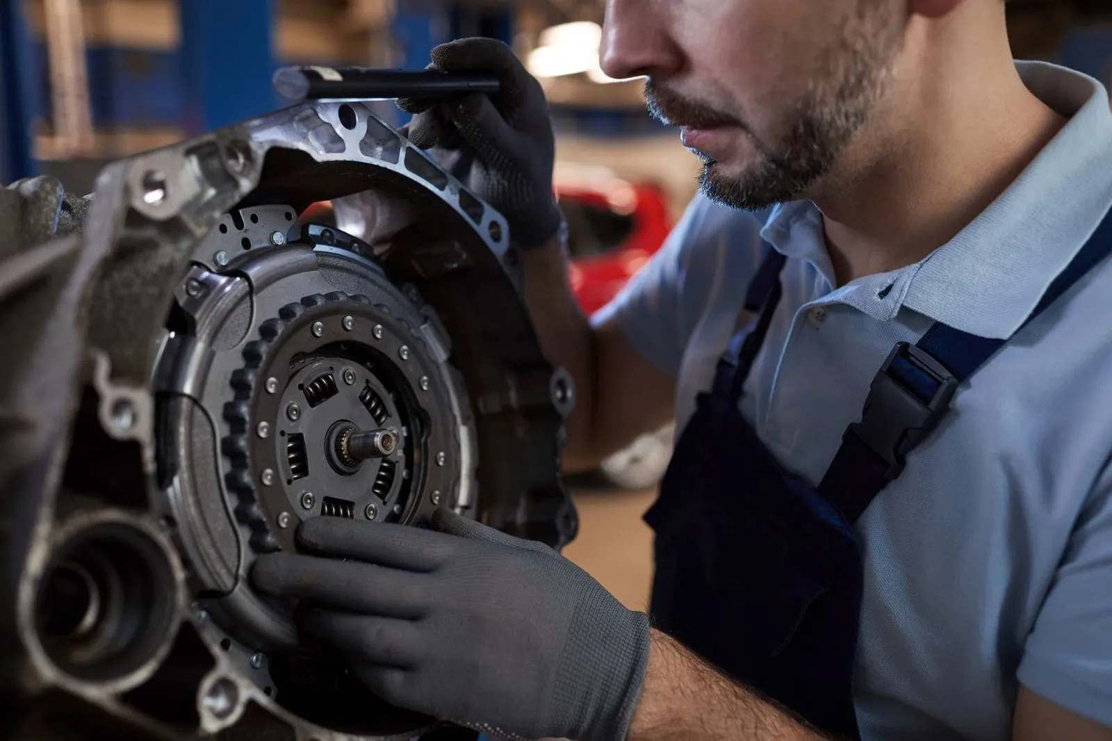 Mechanic fitting a car part