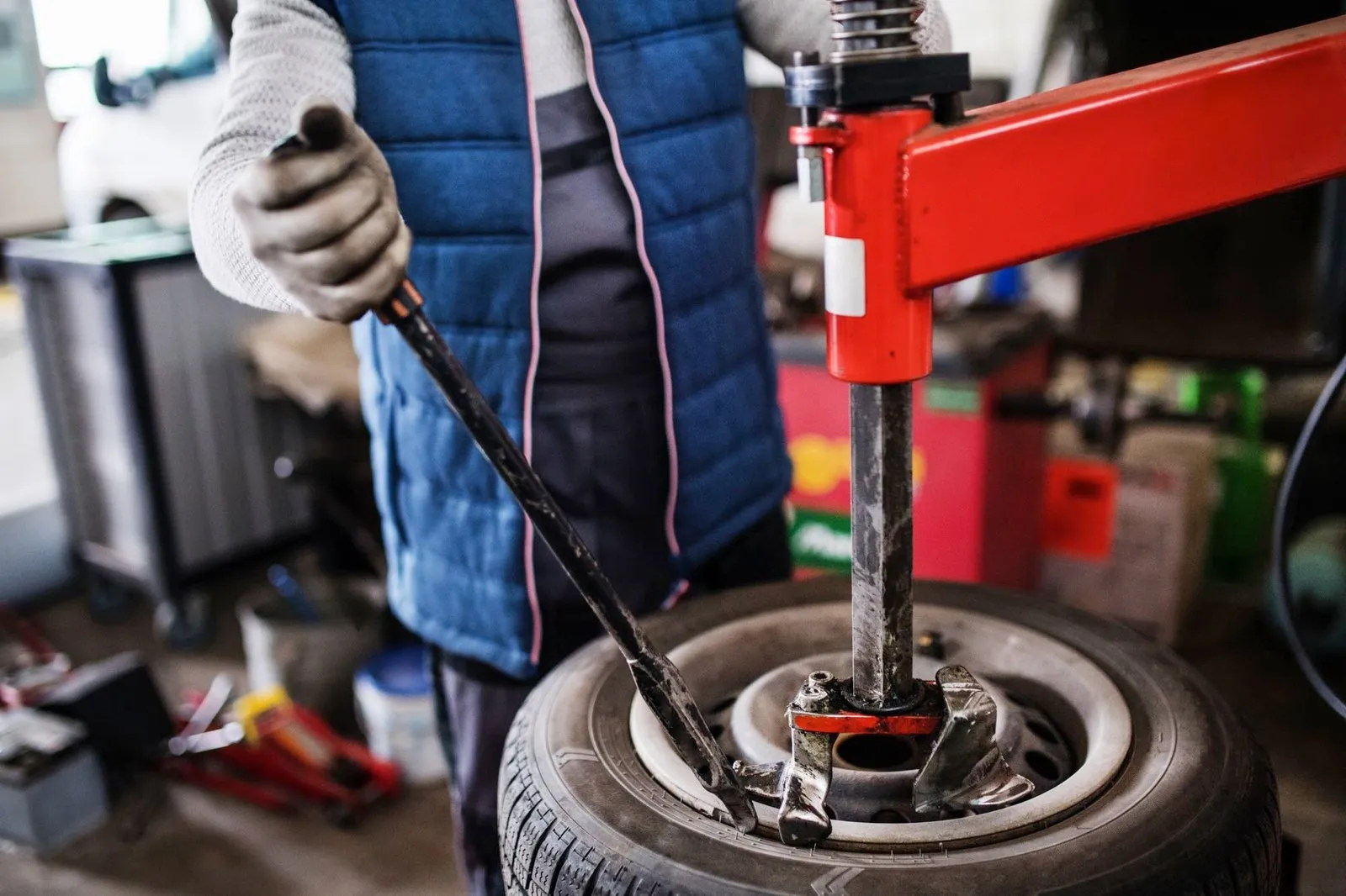 Mechanic working on a car in a garage
